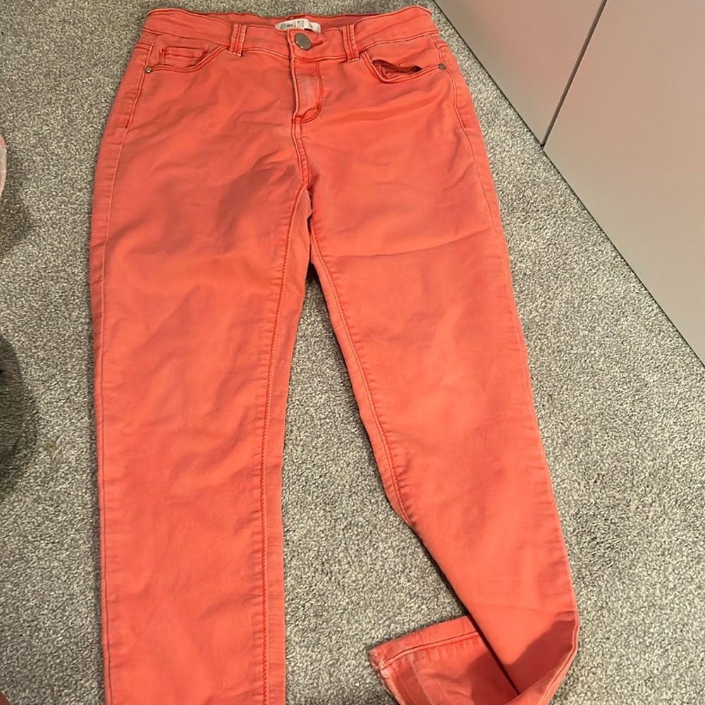 coral colored jeans
